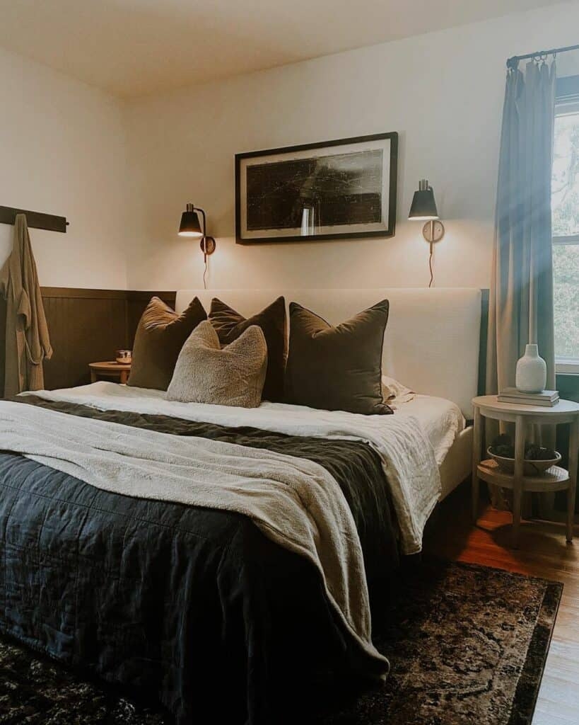 Bed Set with Black Gold Sconces and Dark Wainscoting Detail