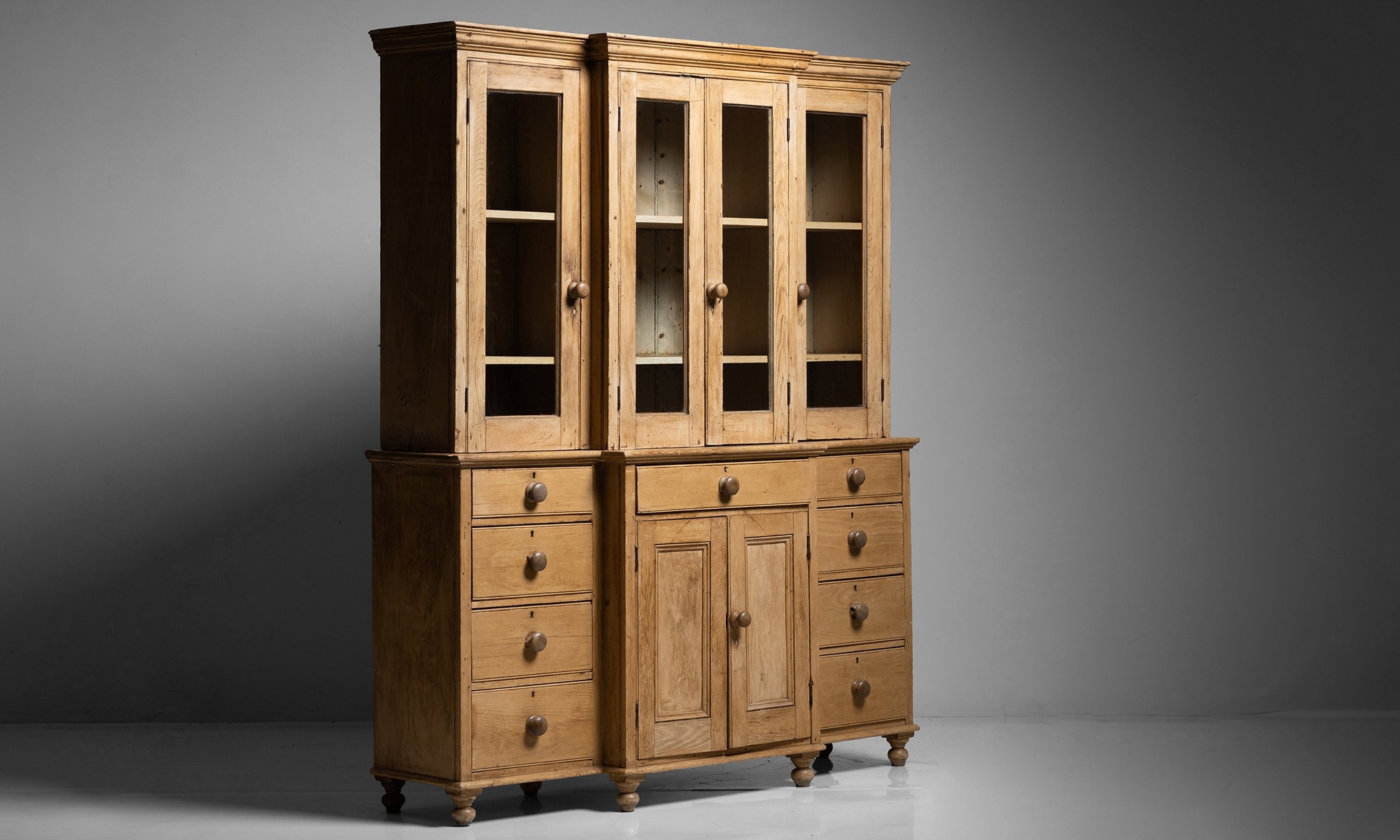 Breakfront Cabinet: Eight Drawer Configuration and Honey Pine