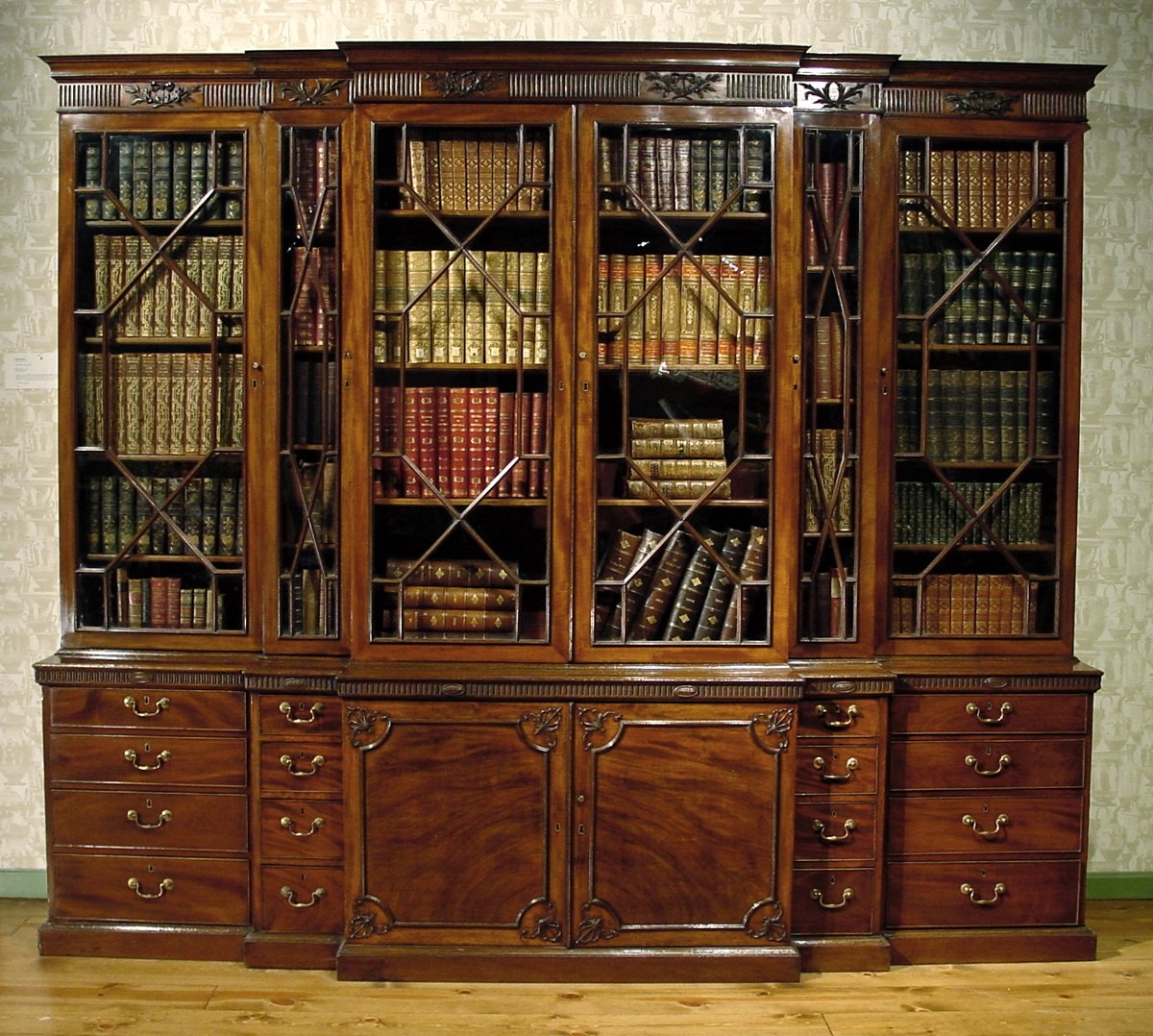Breakfront Cabinet Featuring Astragal Glazing and Carvings