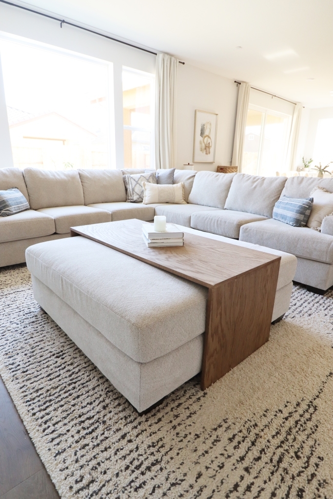 Bridge Coffee Table with Over Ottoman Base and Waterfall Edge