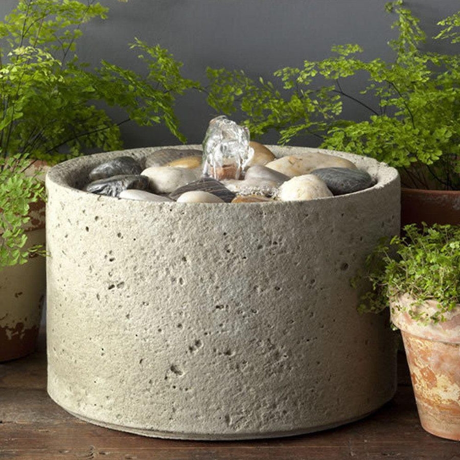 Bubble Fountain Pitted Stone Cylinder with Smooth River Rocks