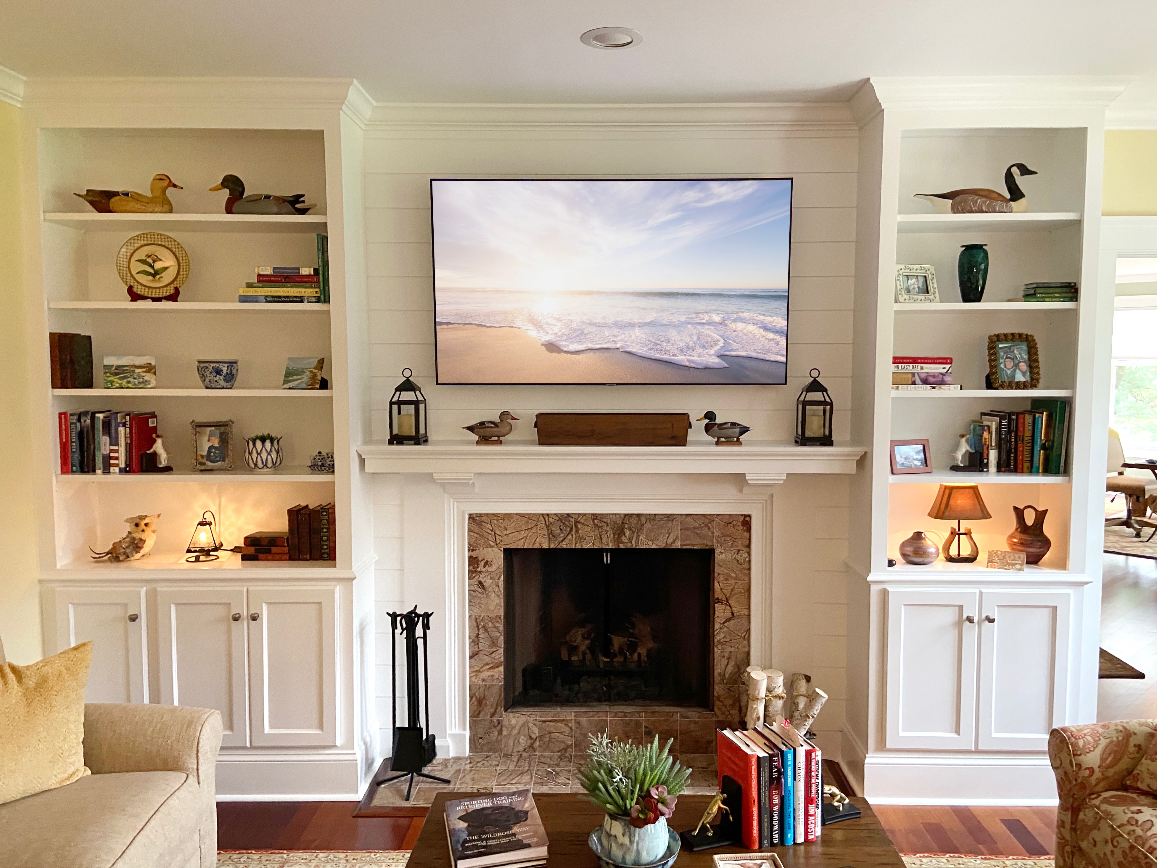 Built In Cabinetry With Shiplap Backdrop and Shelf Lighting
