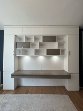 Built In Desk with Integrated Puck Lights and Asymmetrical Storage