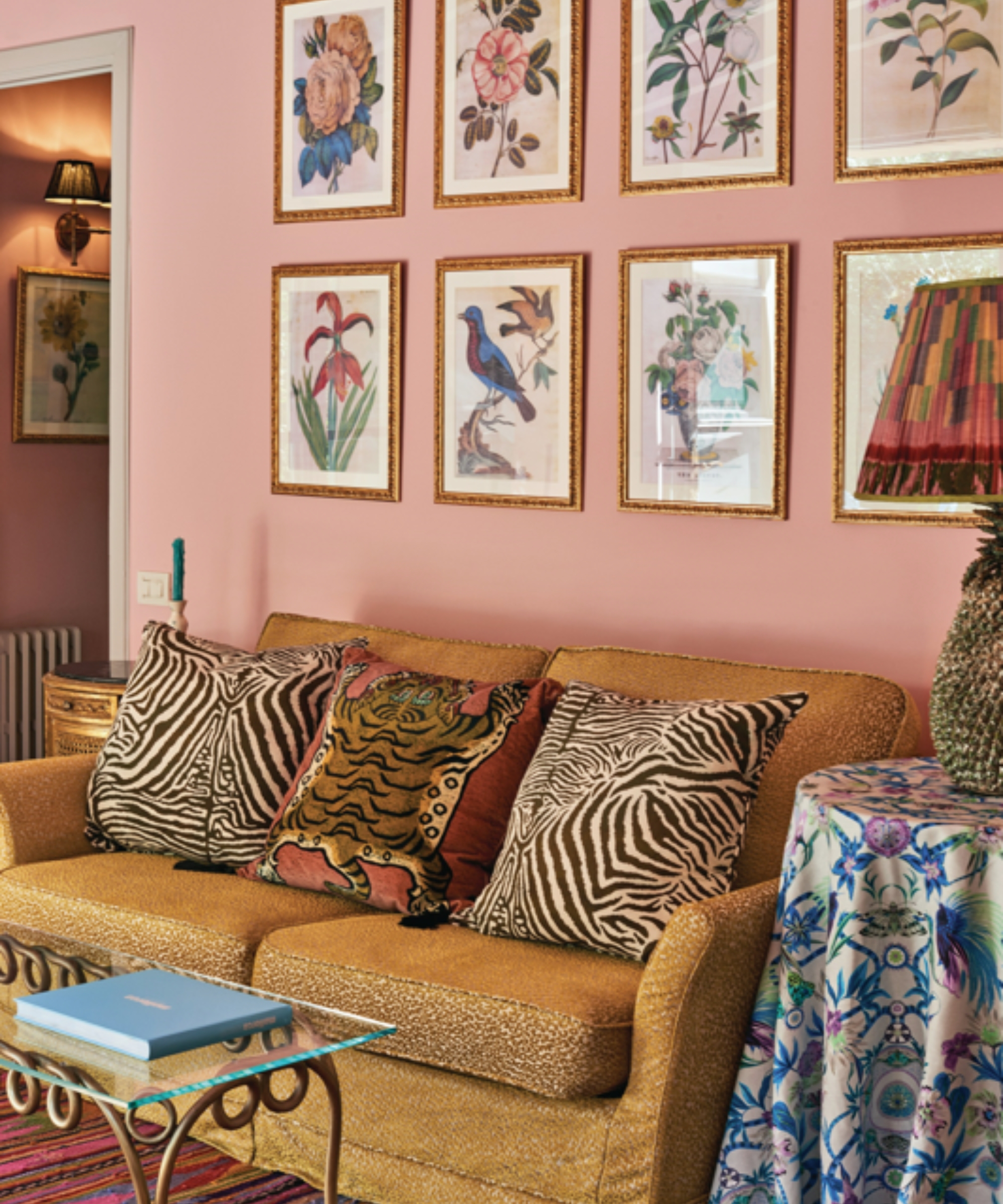 Camel Colored Couch with Pink Walls and Botanical Prints