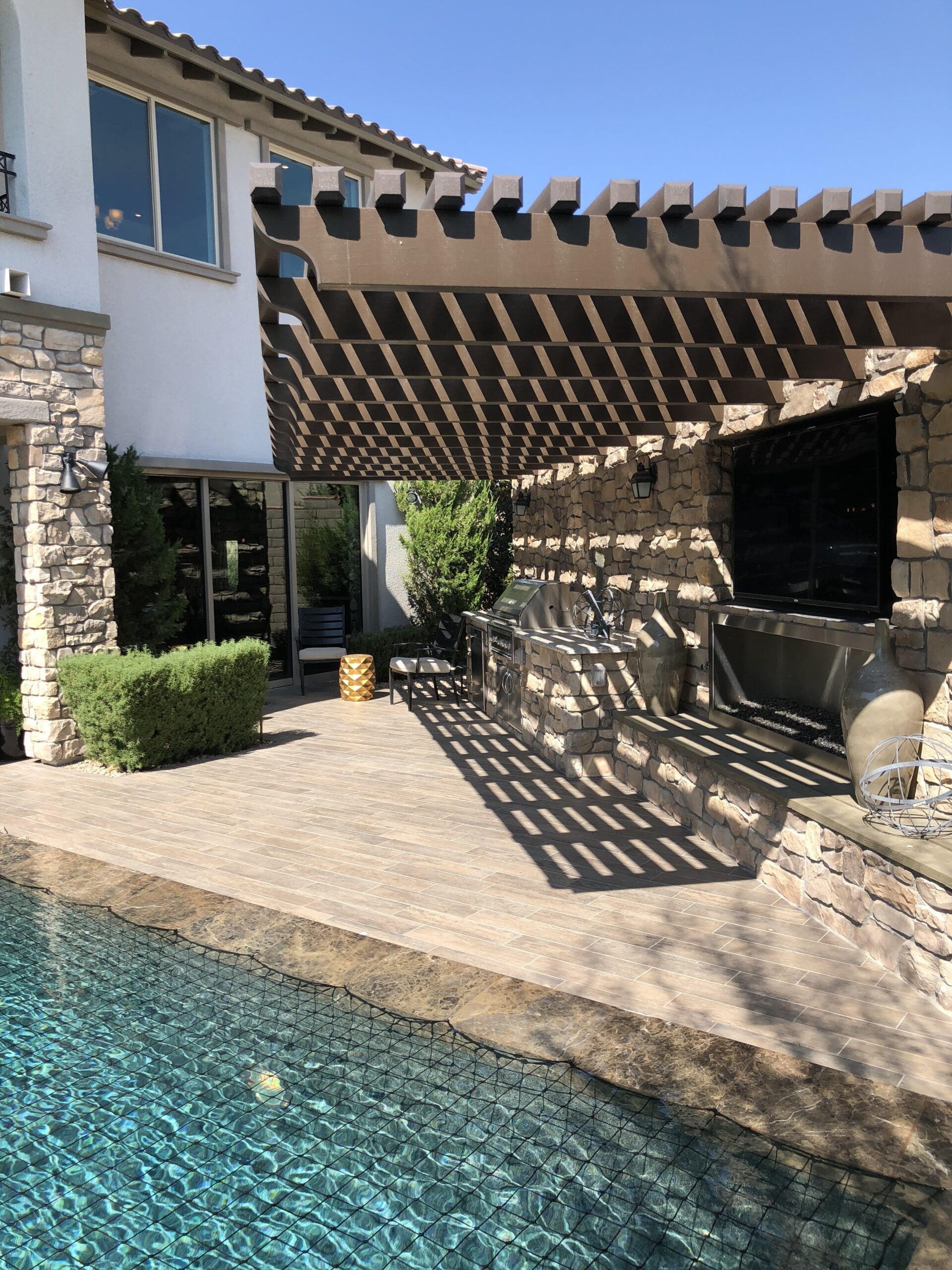 Cantilevered Pergola over Stacked Stone Cladding & Fireplace