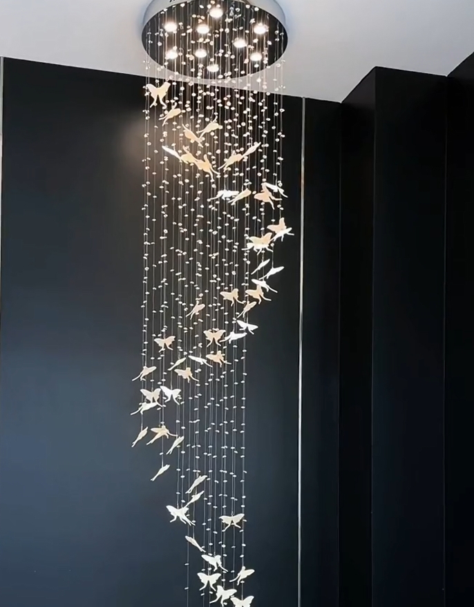 Chandelier Against Matte Black Backdrop Cascading Butterfly Light