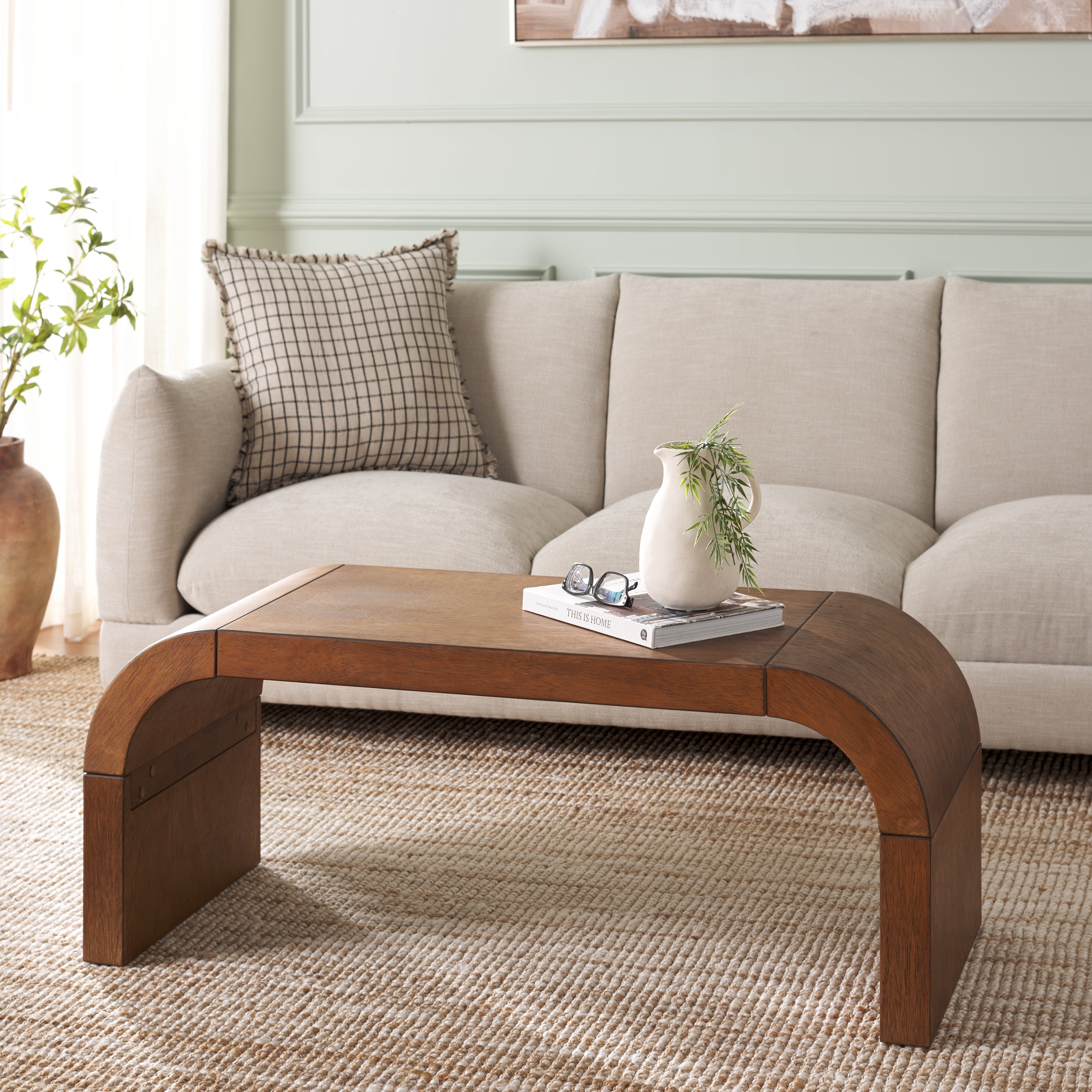 Coffee Table featuring Curved Sides and Segmented Base