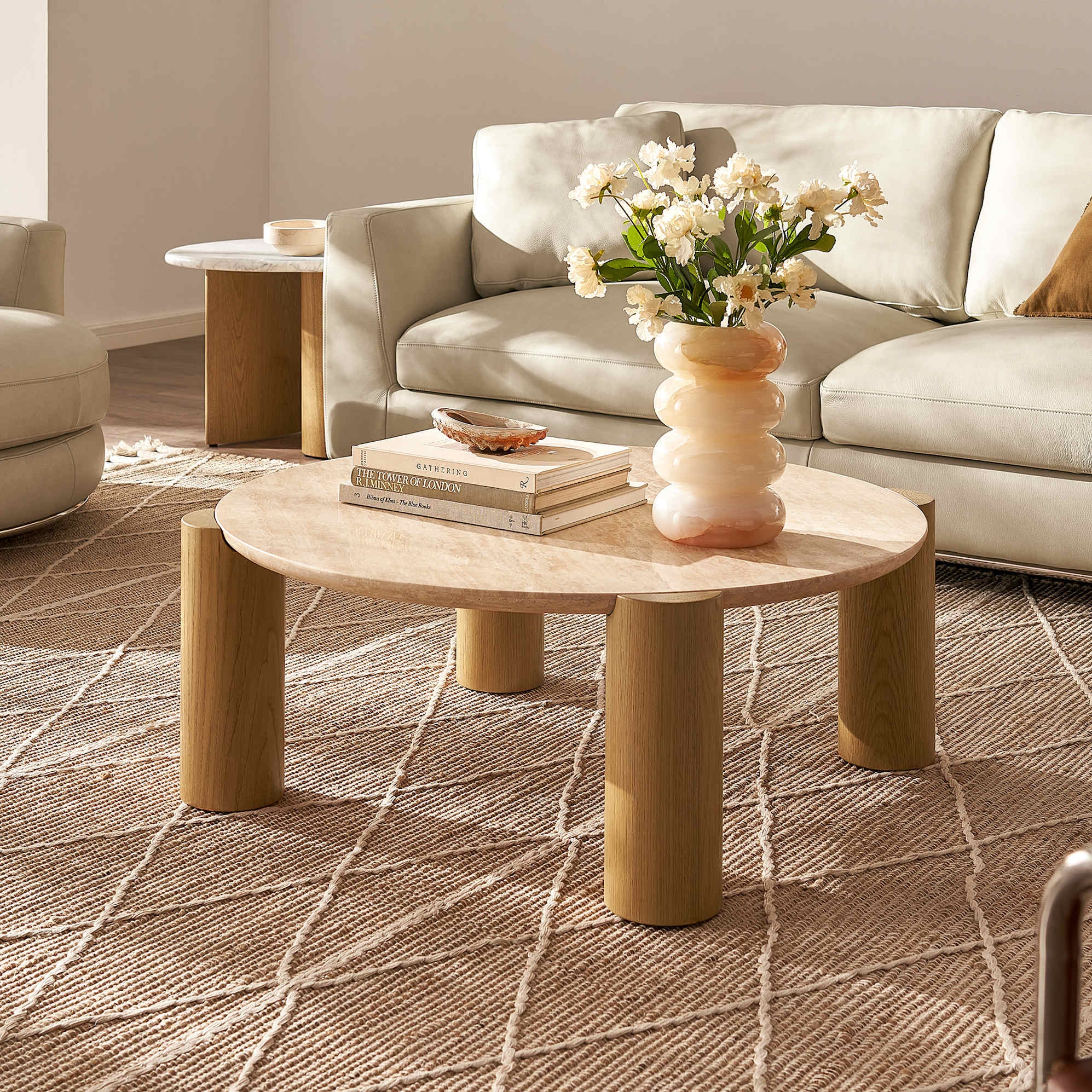 Coffee Table with Cylindrical Legs and Stone Like Round Top