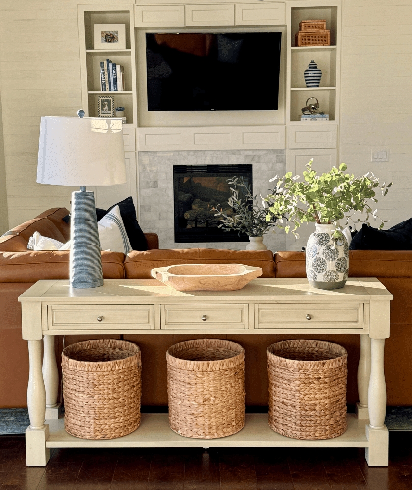 Console Table displaying Woven Baskets and Cream Sofa Table Setup