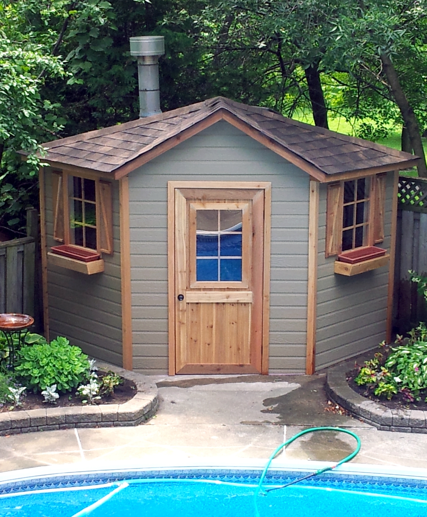 Corner Shed with five-sided shape and rustic cedar accents