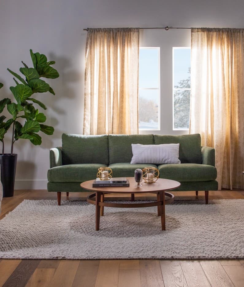 Dark Green Sofa With Tapered Legs Round Wood Table