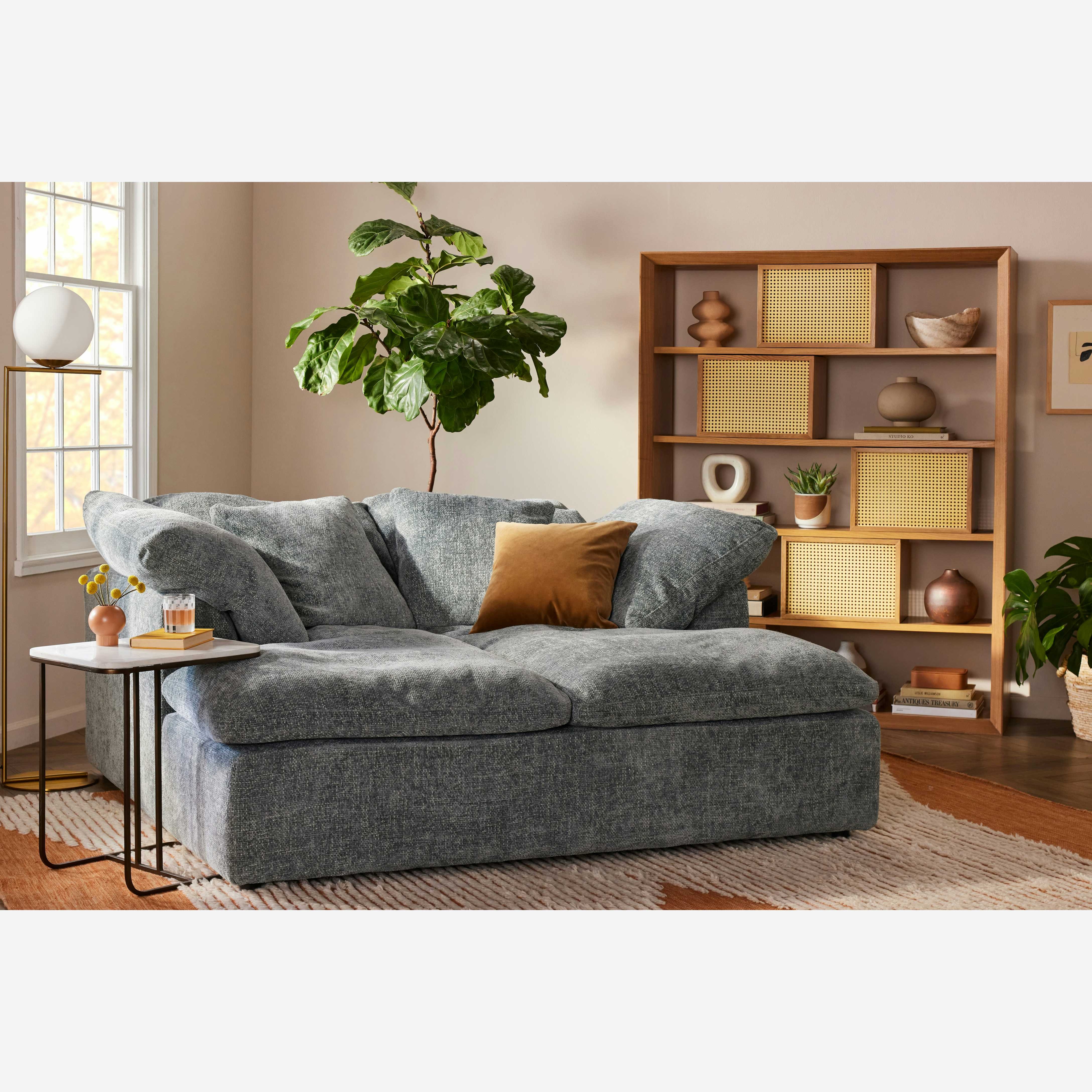 Daybed Featuring Deep Seating and Cane Door Details