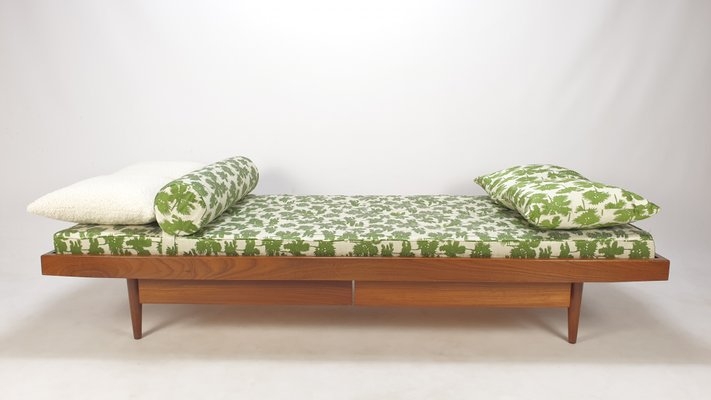 Daybed Featuring Green Leaf Print Upholstery and Storage