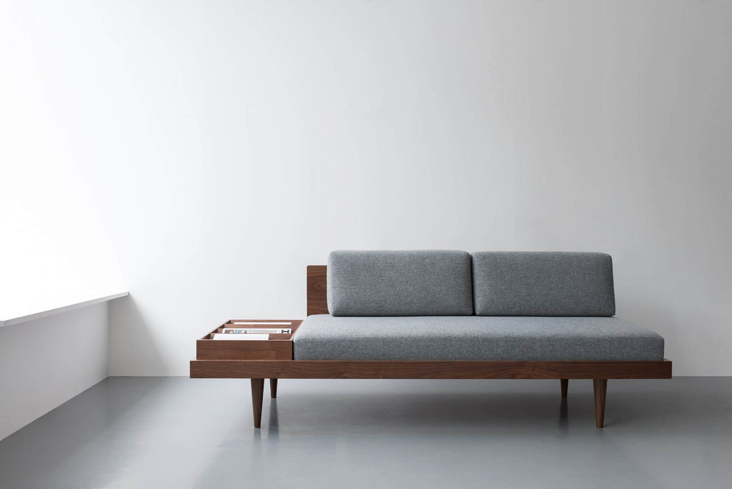 Daybed With Integrated Magazine Rack and Walnut Toned Frame