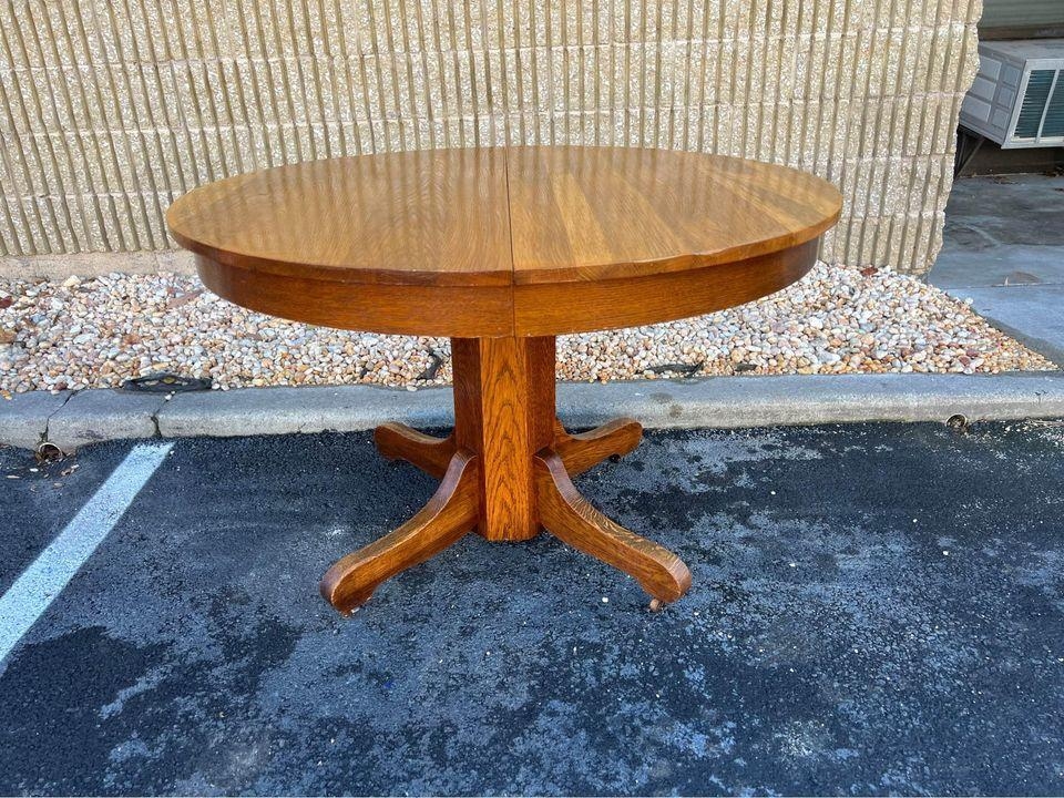 Dining Table: Expandable top with antique arched feet