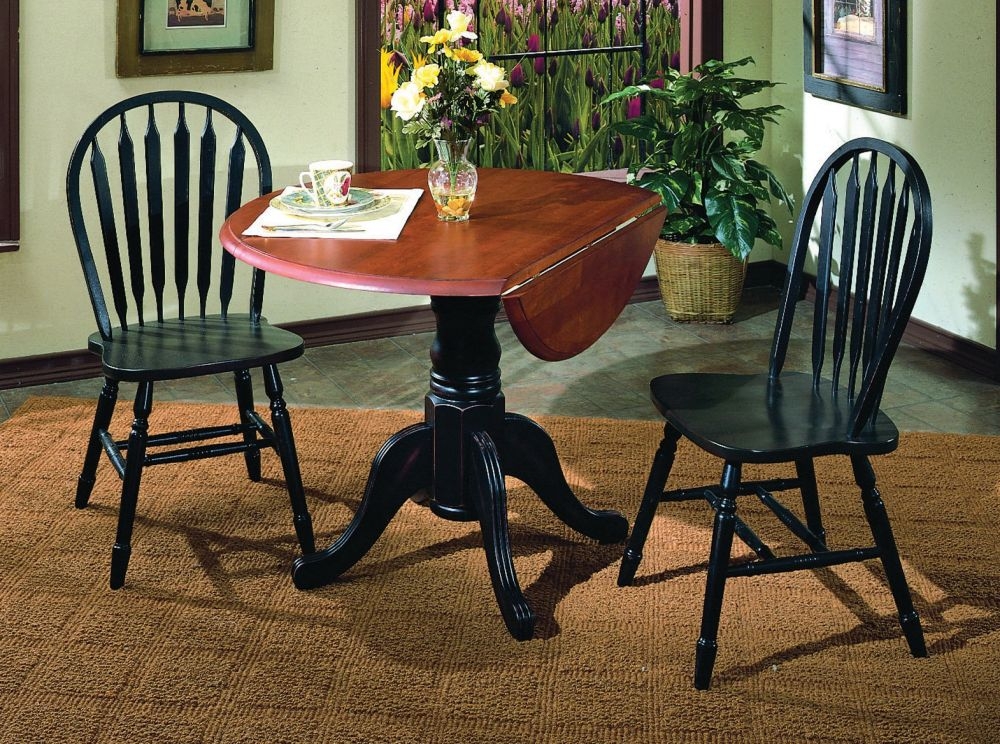Drop Leaf Table with Pedestal Base and Black Windsor Chairs