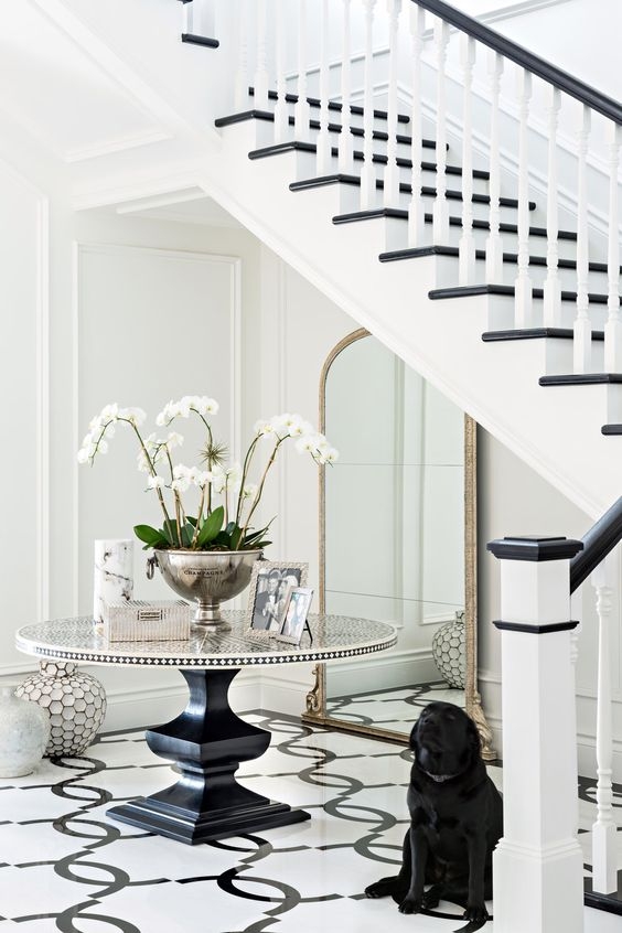 Entry Table Vignette Over Geometric Floor Tile Pattern