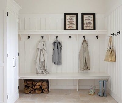 Entryway Storage with Full Height Paneling and Firewood Storage