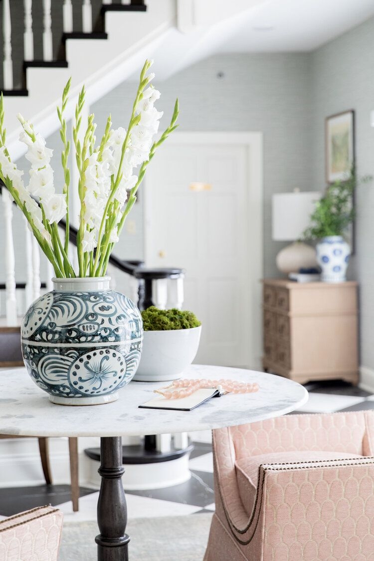 Entryway Table With Marble Pedestal And Quilted Pink Chairs