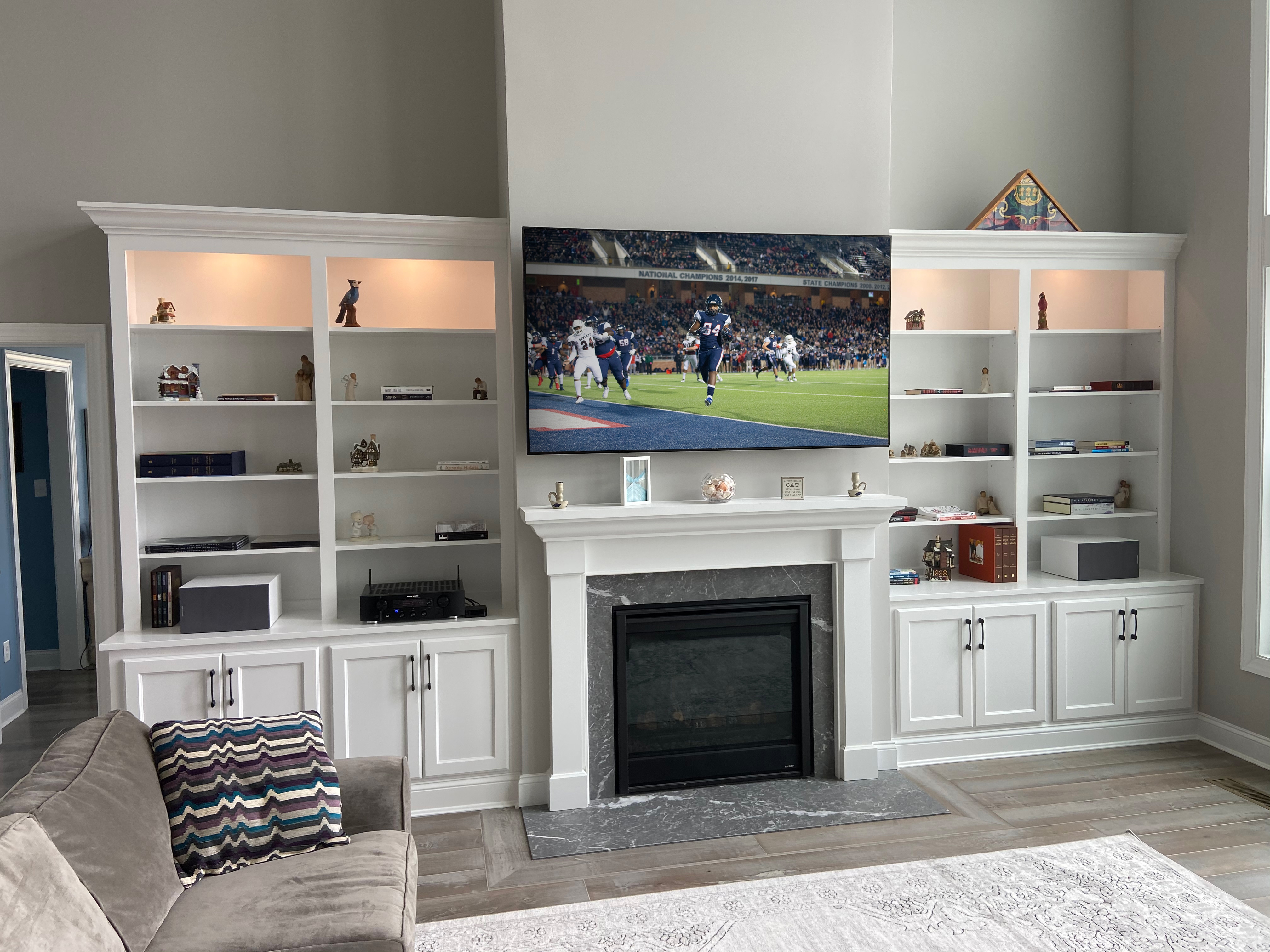 Fireplace Built Ins with Shaker Doors and Gray Stone Hearth