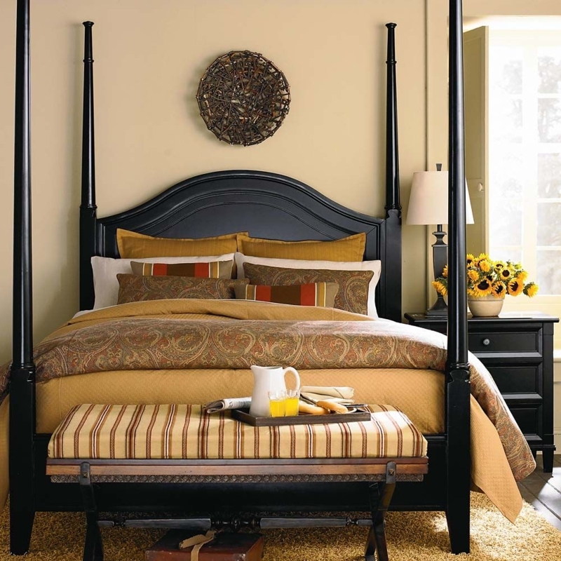 Four Poster Bed Showcasing Arched Headboard and Paisley