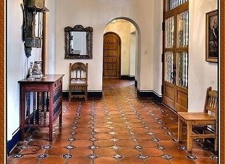 Foyer Hallway with Patterned Terracotta Floor and Arches
