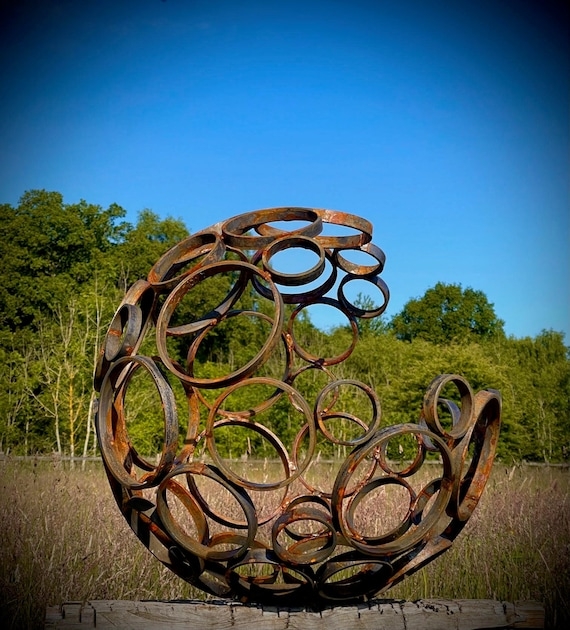 Garden Sculpture featuring Nested Rings Rusty Metal Sphere Orb