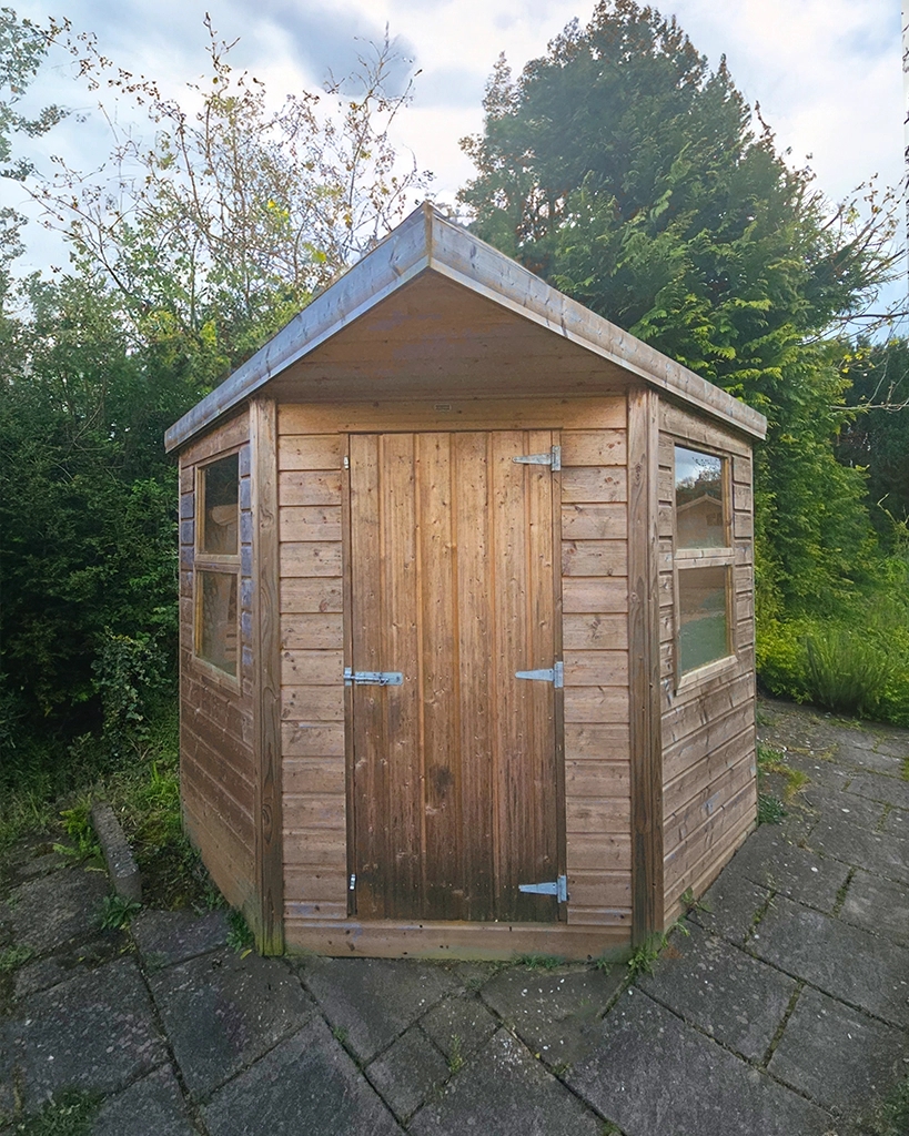 Garden Shed with corner-fit design and rustic gabled roof