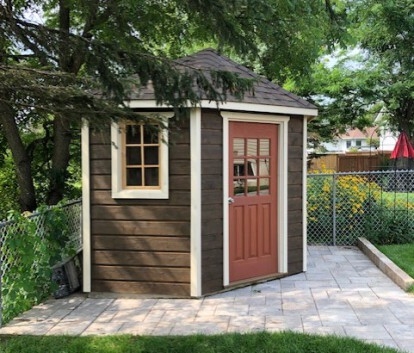 Garden Shed with terracotta entry door and five-sided footprint