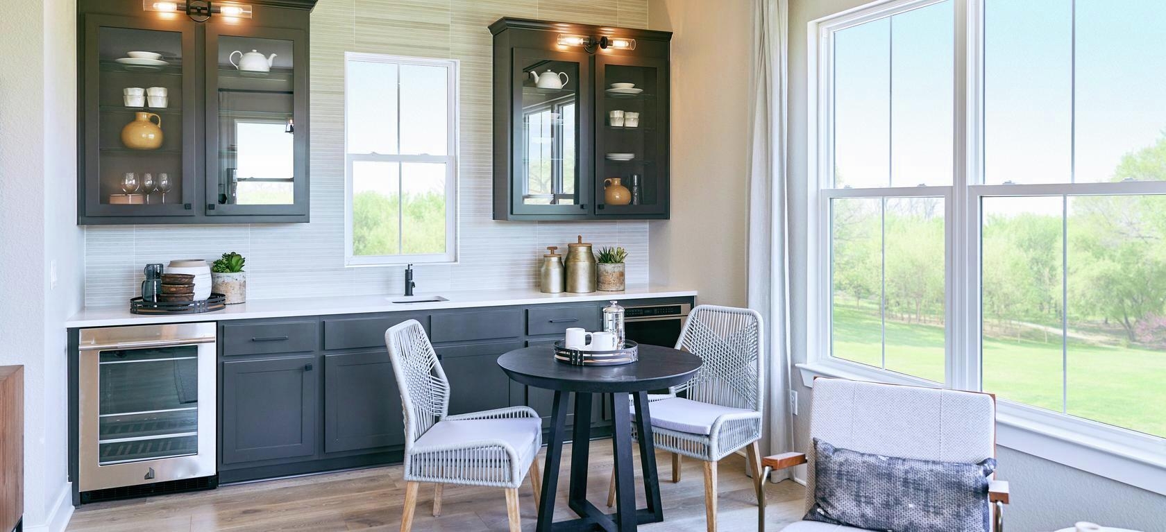 Home Bar with Charcoal Shaker Cabinets and Woven Gray Chairs