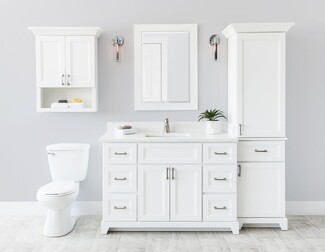 Linen Tower In White Shaker Style With Elegant Crown Molding