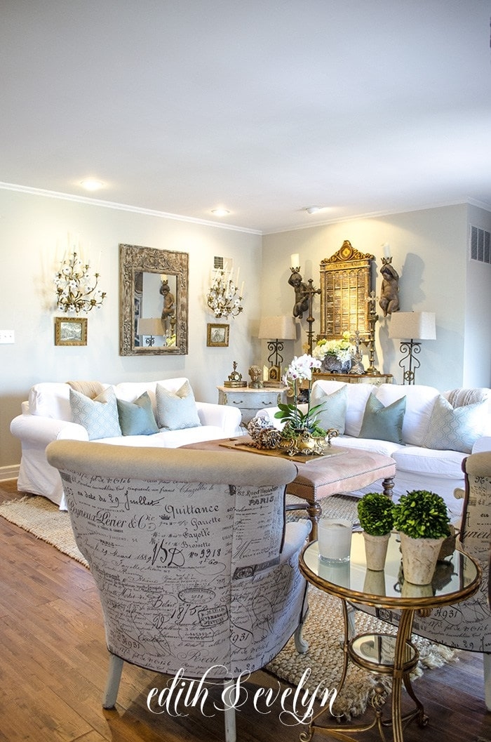 Living Room Set displaying Script Upholstery and White Slipcovers