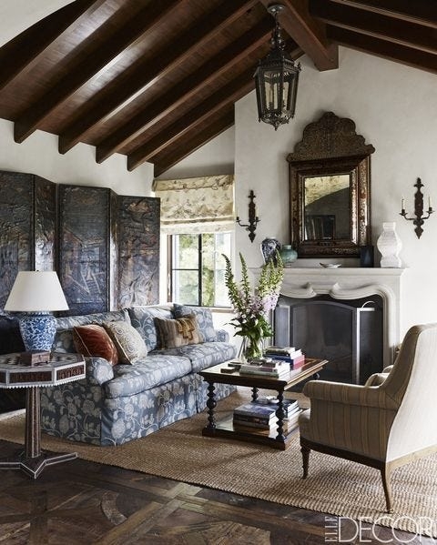 Living Room Set including Indigo Floral Sofa and Beamed Ceiling