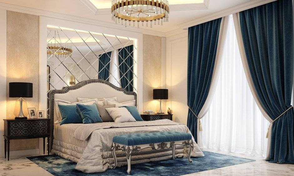 Master Bedroom with Blue Velvet Accents and Mirrored Wall