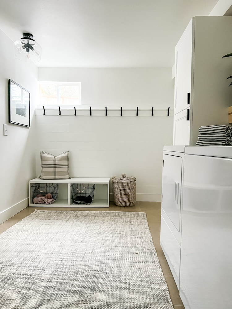 Mudroom Bench with Shiplap Accent Wall and Wire Basket Storage
