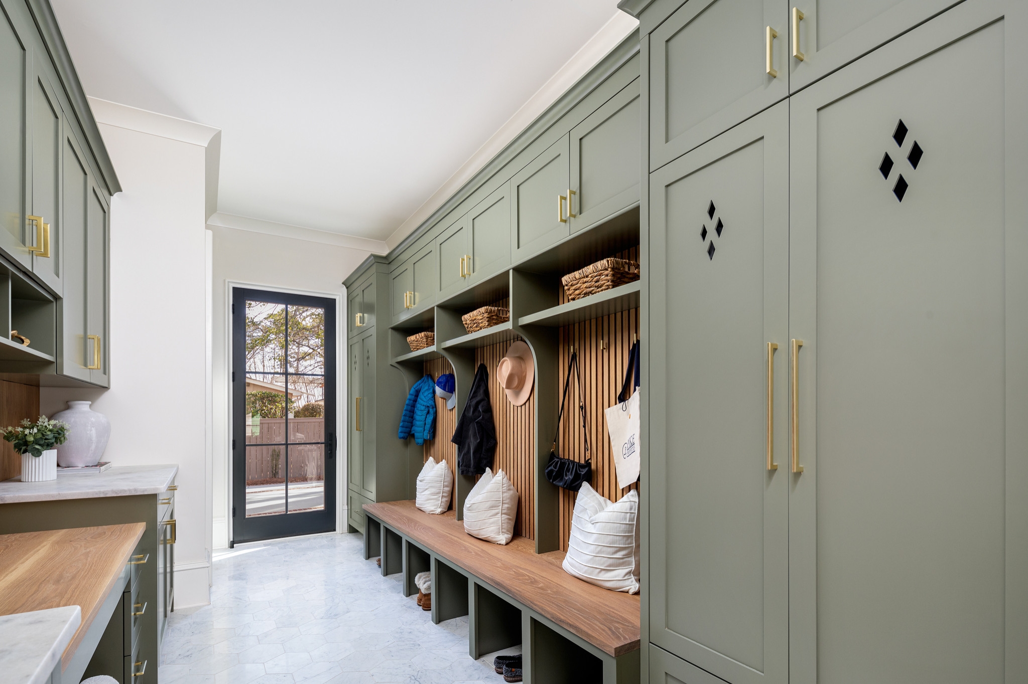 Mudroom Cabinetry with Sage Green Finish and Diamond Cutouts