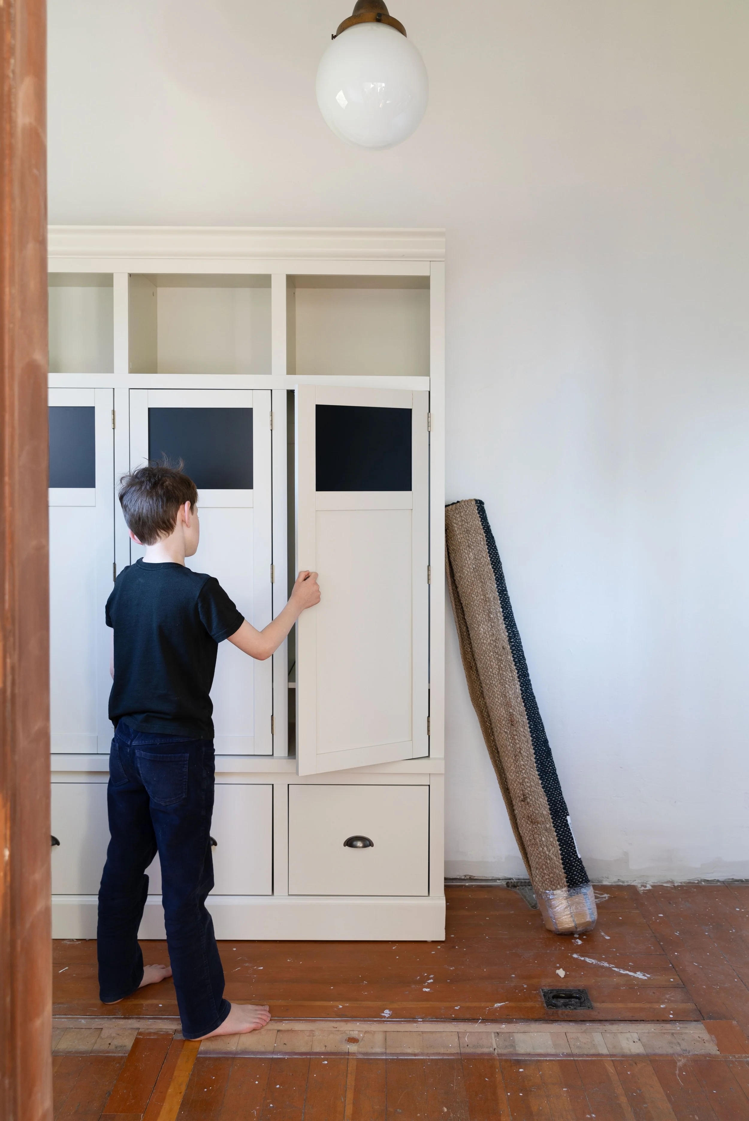 Off-White Mudroom Lockers with Chalkboard Panels