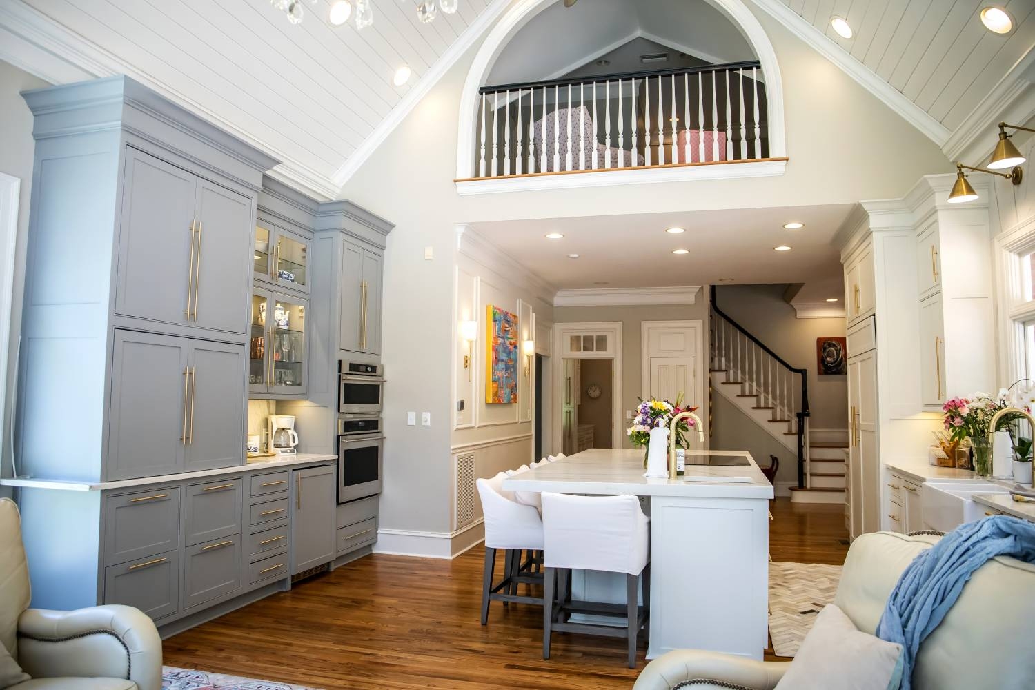 Open Concept Kitchen: pale blue cabinetry and lighting layout