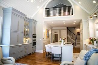 Open Concept Kitchen: pale blue cabinetry and lighting layout