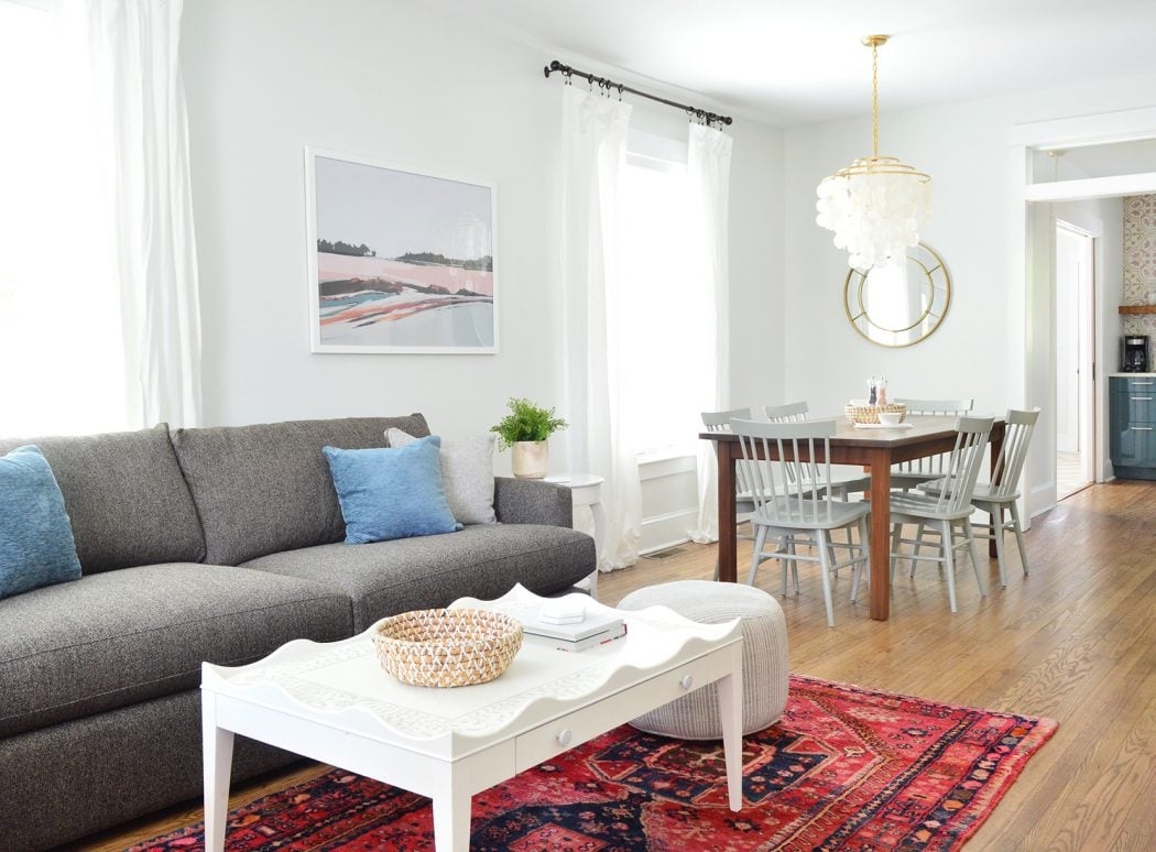 Open Concept Living Space: Scalloped White Coffee Table and Rug