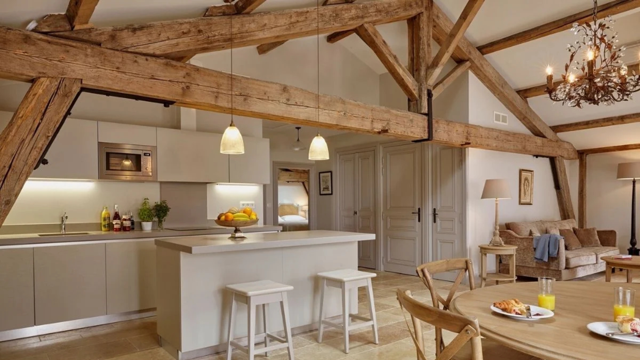 Open Plan Kitchen: frosted glass pendants on timber trusses