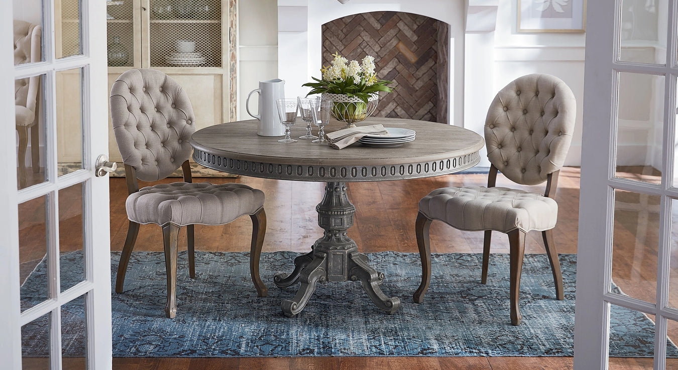 Pedestal Dining Table displaying Tufted Oval Back and Feet