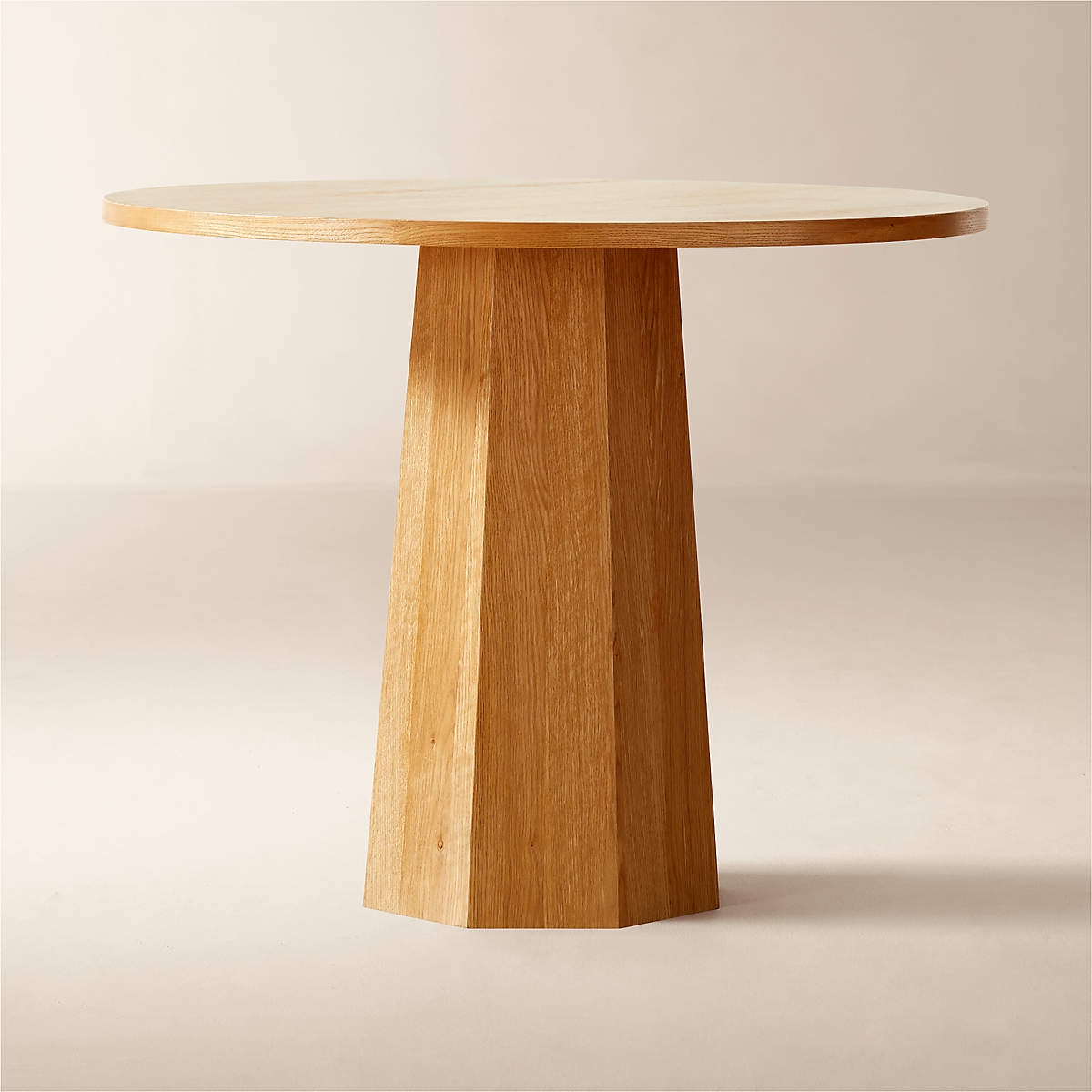 Pedestal Dining Table: Faceted pedestal with matte finish