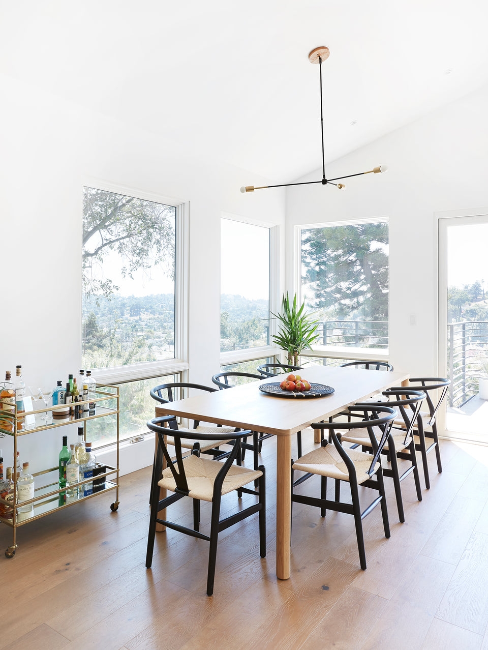 Pendant Light: minimalist swivel canopy for wishbone chairs