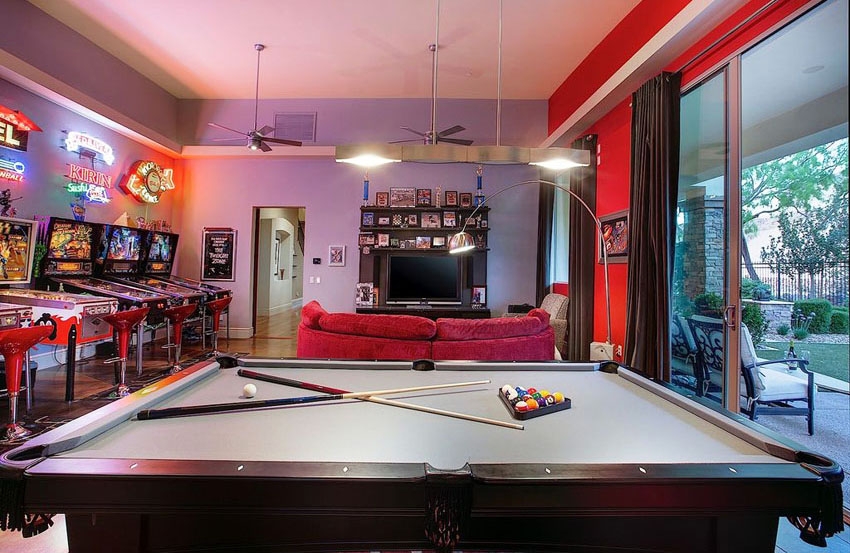 Pool Table with Neon Lit Walls for Vibrant Red Man Cave Ideas