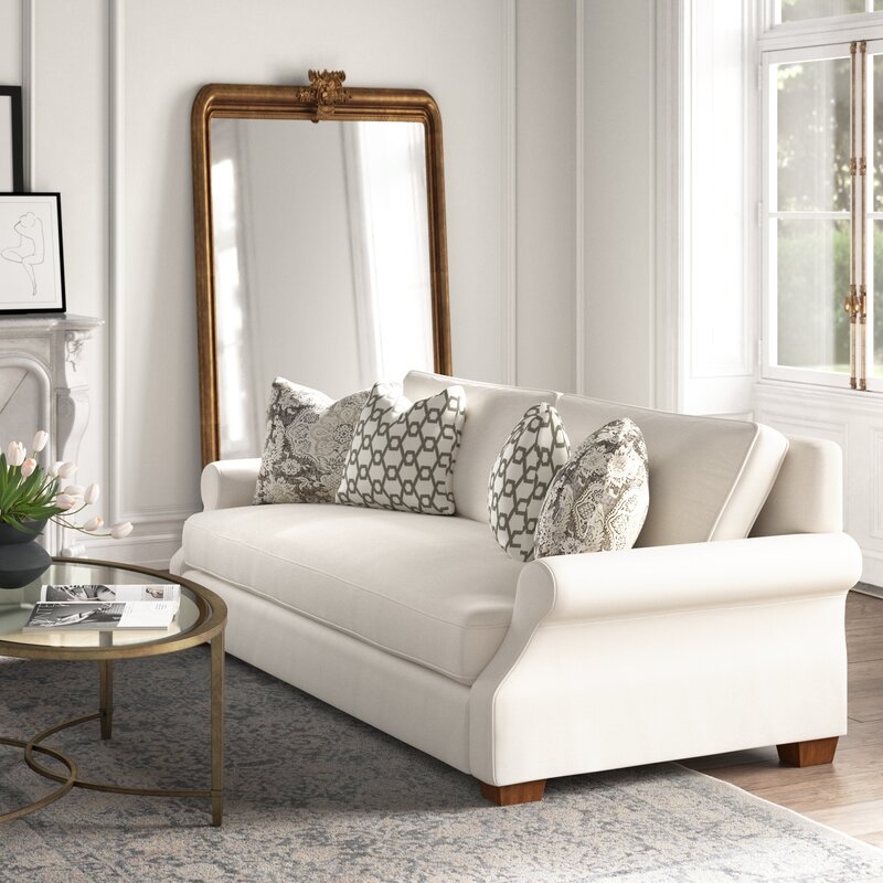 Rolled Arm Sofa featuring Flared Arms and Gold Mirror Decor