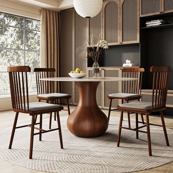 Round Dining Table: Sculptural Pedestal and Stone Top