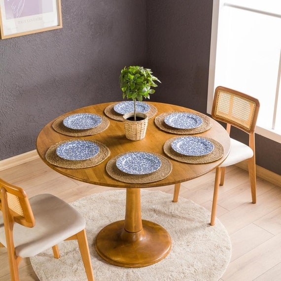 Round Dining Table: Tulip pedestal base and cane back chairs