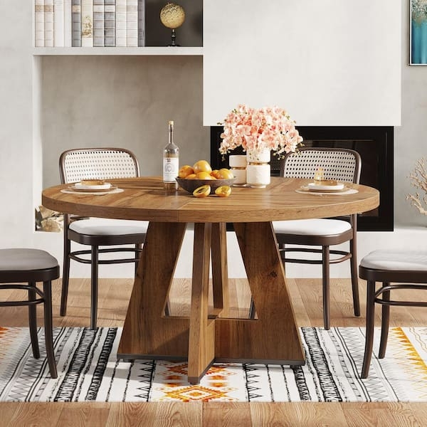 Round Dining Table utilizing Angled Pedestal Legs in Oak