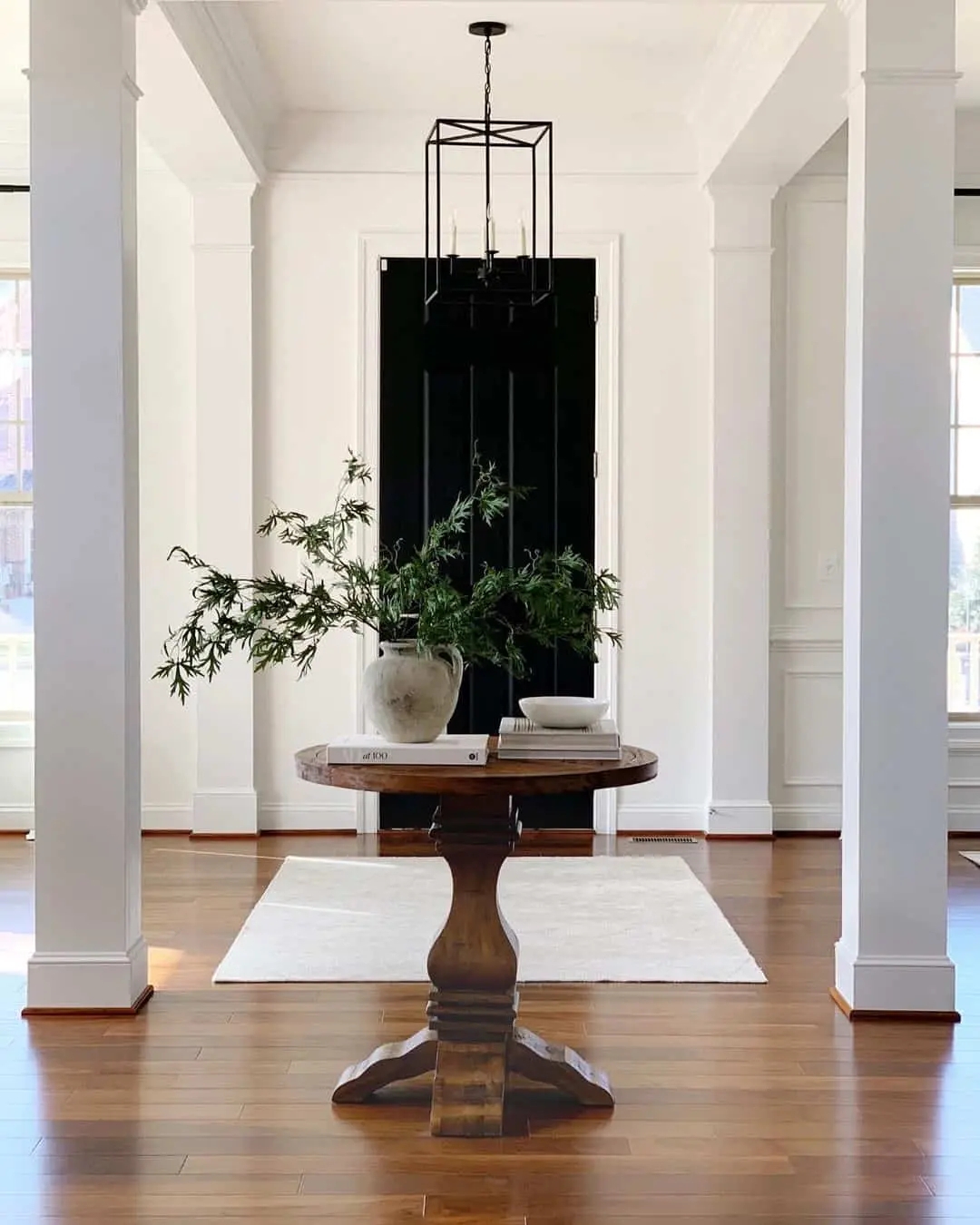 Round Pedestal Table Styling With Geometric Black Lantern